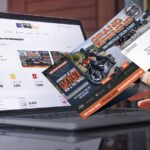 tracking direct mail marketing campaign performance with Spectrum Mail Plus online dashboard with direct mail example in hand