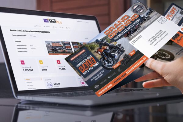 tracking direct mail marketing campaign performance with Spectrum Mail Plus online dashboard with direct mail example in hand