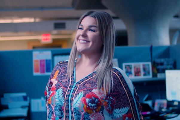 Spectrum Customer Success Representative in her cubicle